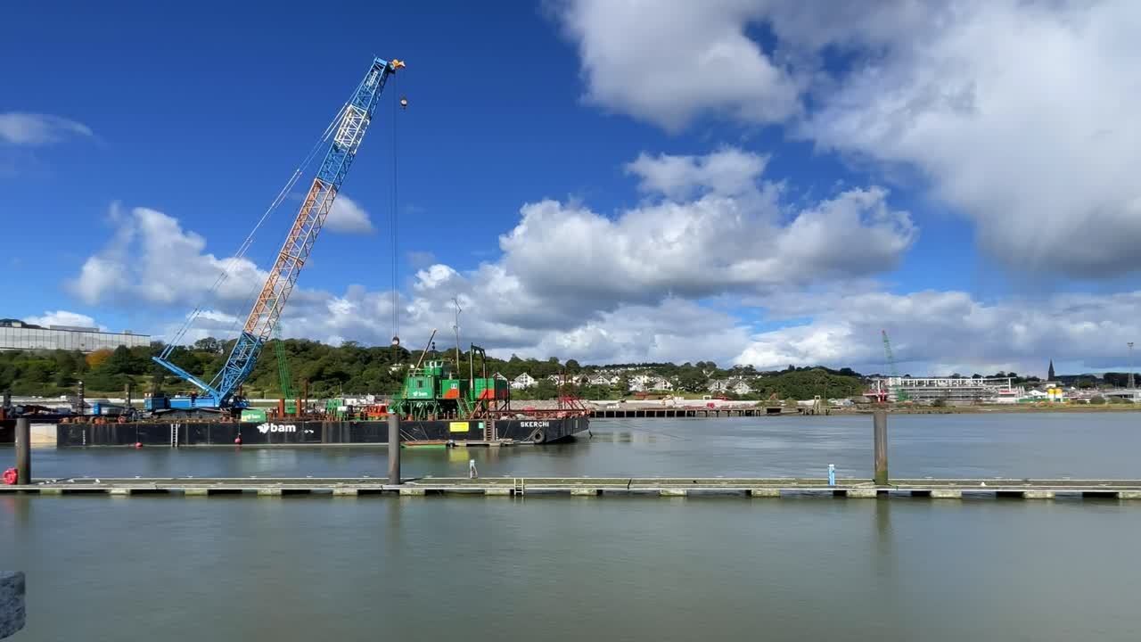 Waterford Ciry Quays Timelapse construction site on North Quays strongly flowing river Suir in Summer