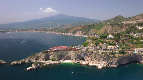 drone shot of the isola bella coastline with the ionian sea