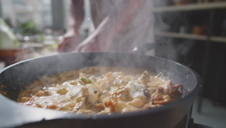 cooking a creamy dish in a kitchen