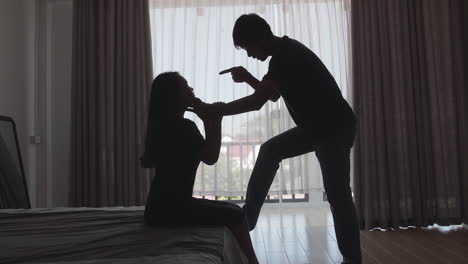 young boyfriend using violence against girlfriend on the bed