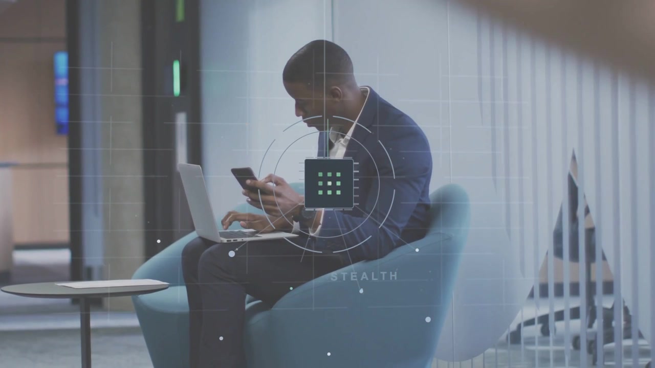 Man switching between phone and laptop for business, passerby crossing causing HUD overlay over him
