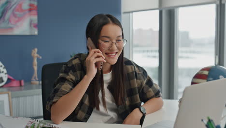 Emotional-woman-chatting-smartphone-at-home-close-up.-Startuper-talking-phone