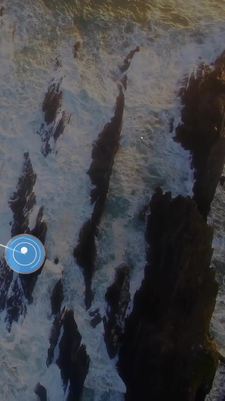 Vertical video: Blue nodes emerging edge, linking phone and music icons via lines over sea for tech