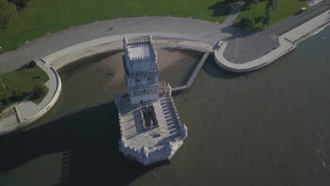 huge sunrise at torre de belem, belem tower, in lisbon, portugal