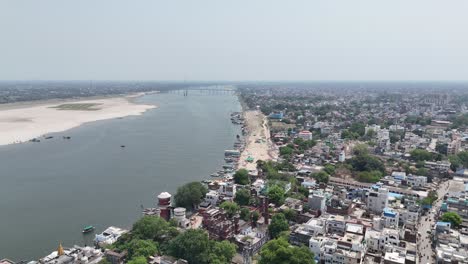 high-angle view capturing the crowded, chaotic energy of varanasi's riverfront, where ancient rituals and modern life blend seamlessly.
