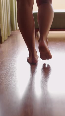 feet walking on wooden floor