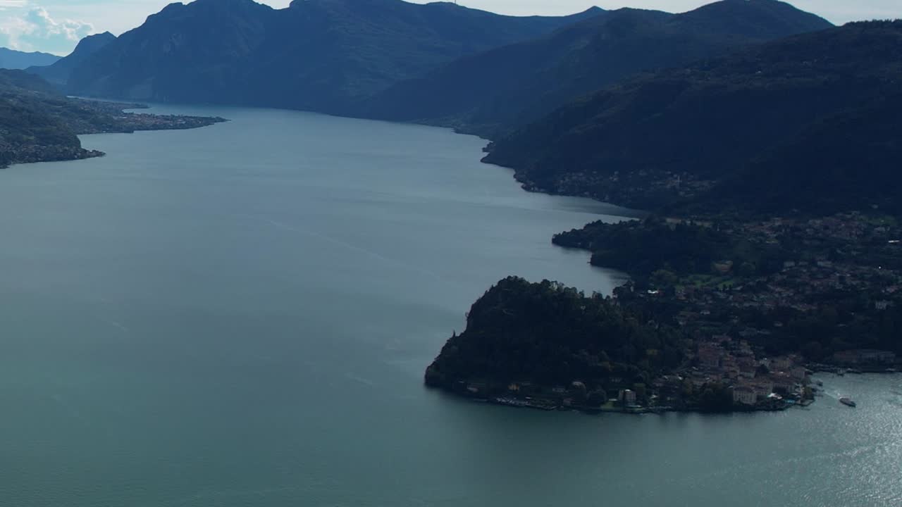 Stunning aerial view of the Alps and lake in Italy during serene weather