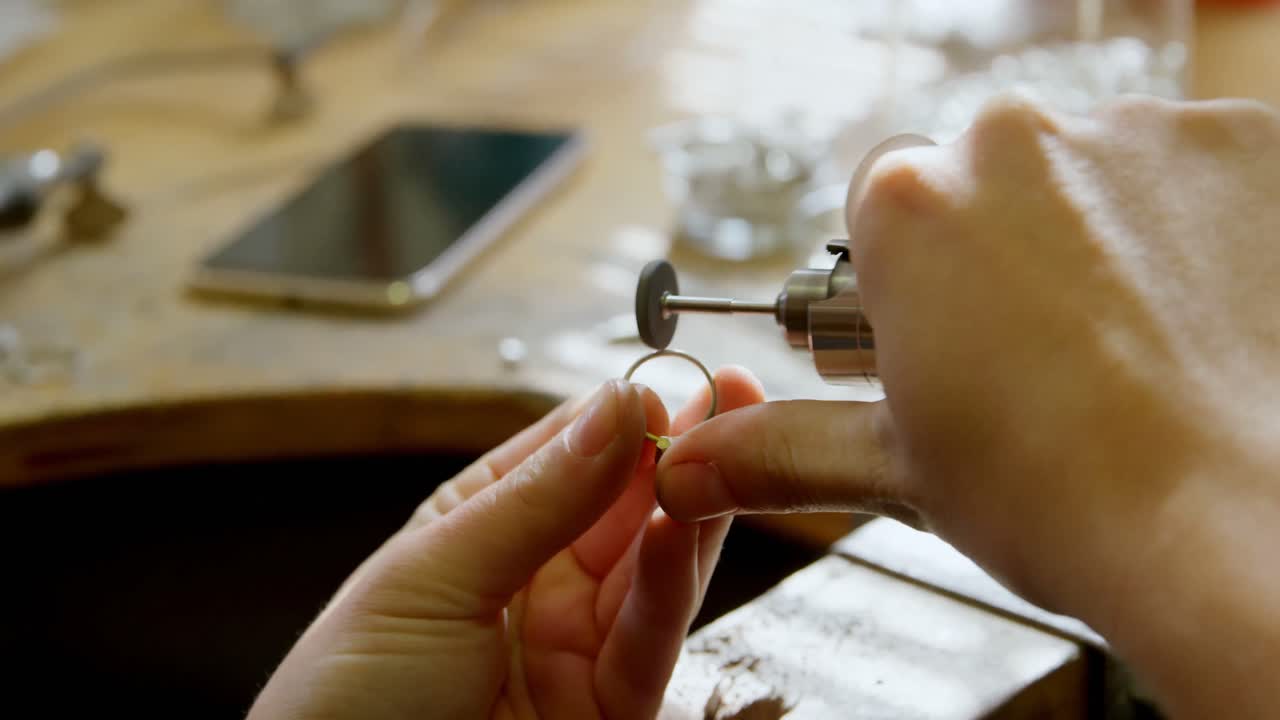 Jewelry designer working in workshop 4k