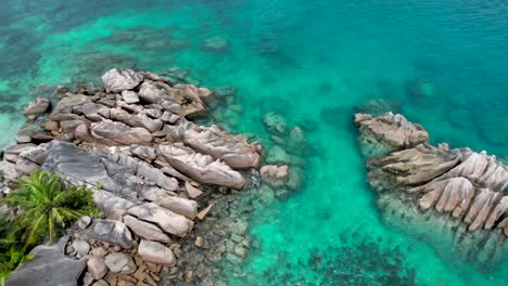 Aerial-view-of-rocky-coastline-on-Curieuse-Island-The-Seychelles