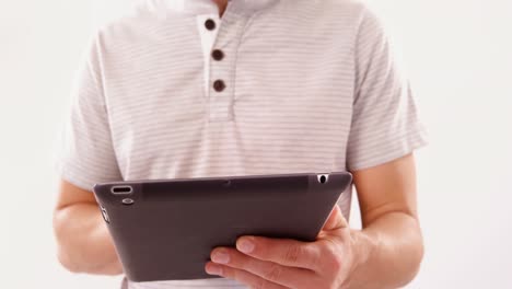 smiling man using digital tablet