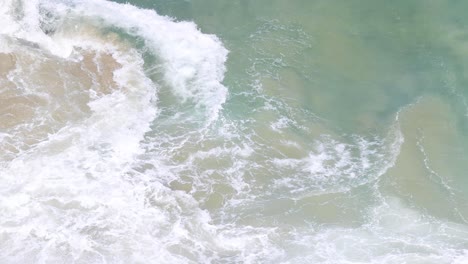 dynamic ocean waves colliding with coastal rocks