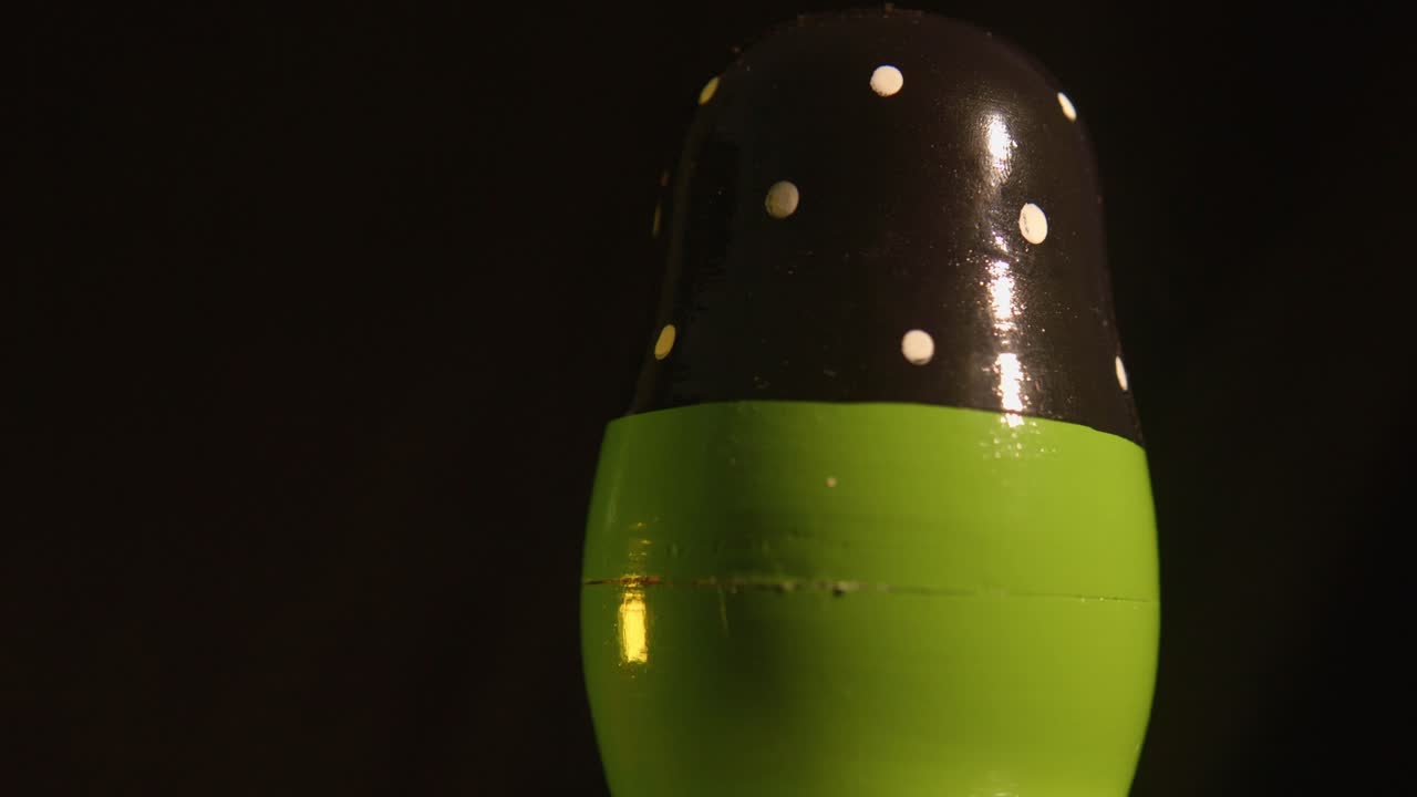 Close-up of a Matryoshka Doll with Changing Colored Lights