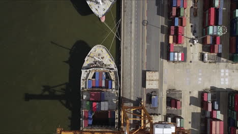 logistic concept aerial view of maritime transport commercial dockyard with cargo ships, containers waiting to be upload and offload cargo containers