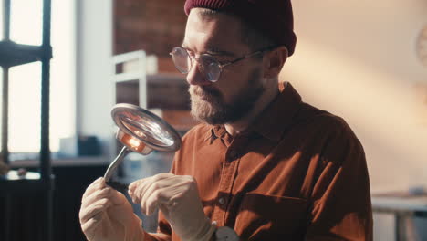 archaeologist inspecting artifact under magnifying glass in laboratory