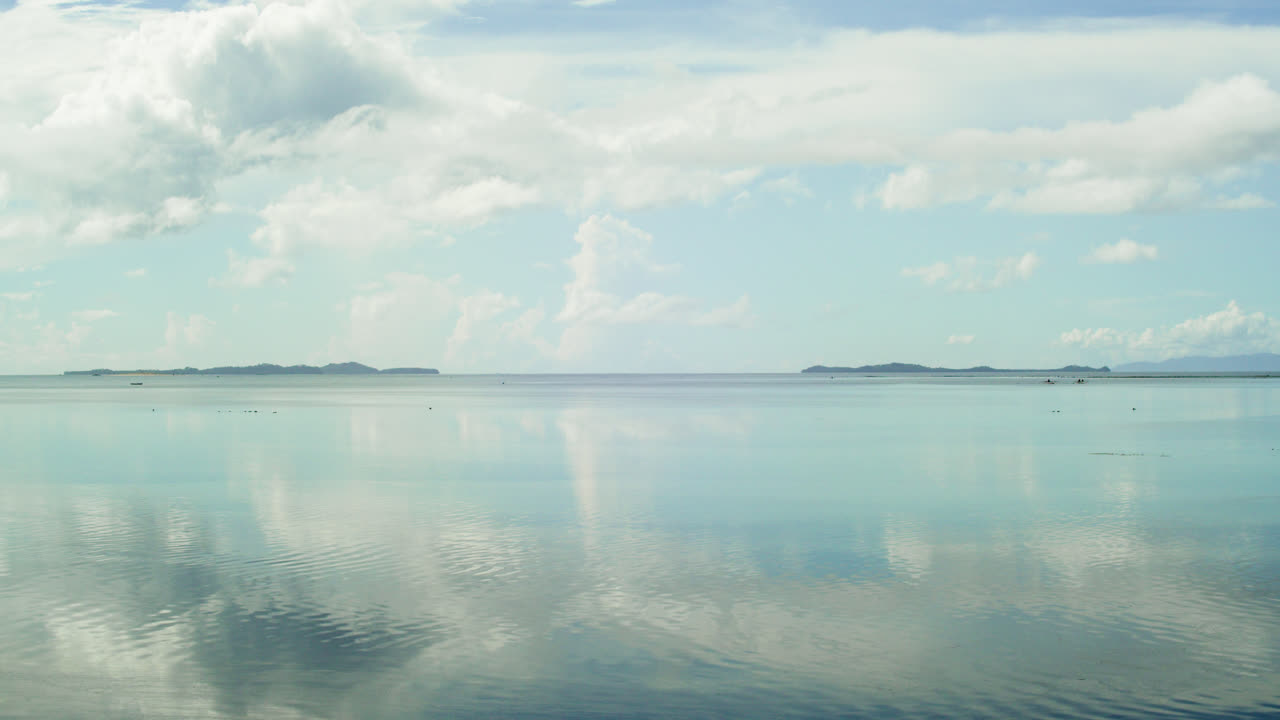 A time-lapse view of clear waters and busy fisher-folks from Secret Beach in Dapa, Siargao.