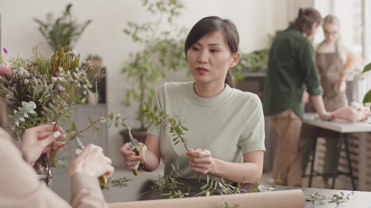 Women Collaborating on Floral Arrangement