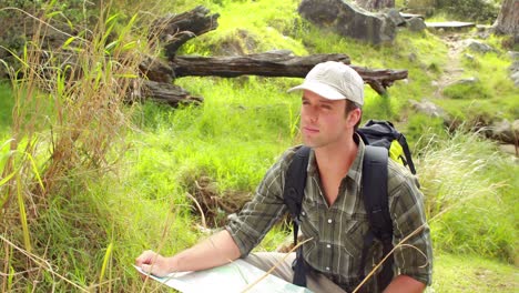 Smiling-man-with-map-hiking-