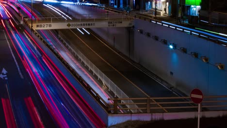 a night timelapse of the traffic jam at the city street in tokyo long shot