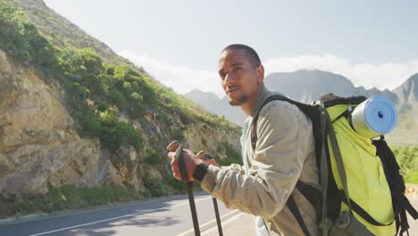 sporty mixed race man with prosthetic leg hiking