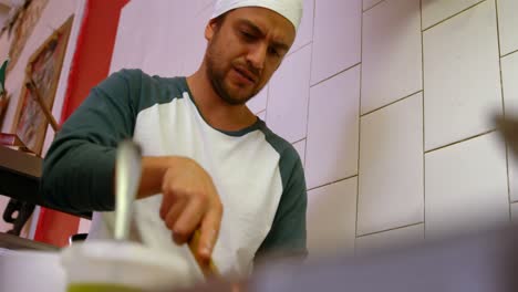 Male-baker-preparing-food-in-kitchen-4k