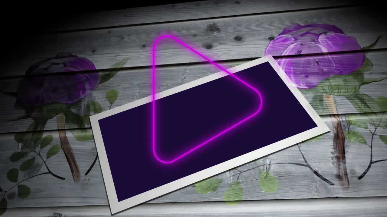 Purple triangle animation over floral design and blank photo on wooden surface