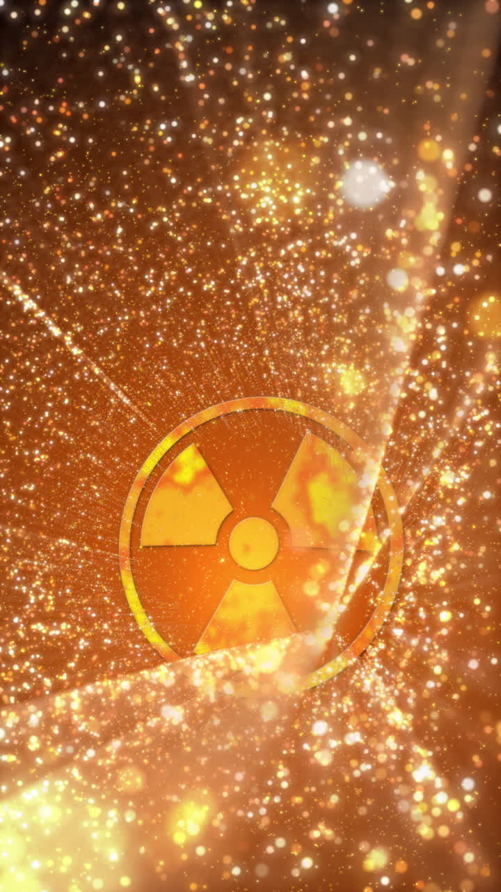 Yellow radioactive animated screensaver with logo. Nuclear energy setting icon animation with bright glowing moving particles. Loop motion graphic. Vertical video.