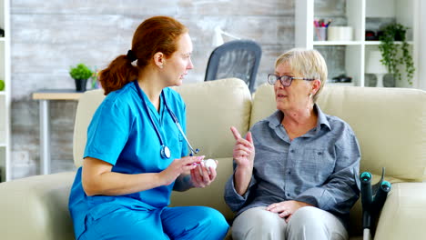 female doctor consultin a senior woman about pills dosage and subscription