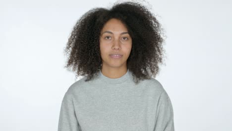 young african woman with thumbs up, white background