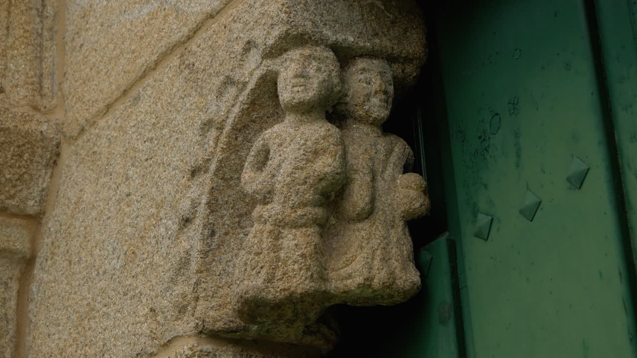 Detailed stonework at the entrance of San Paio de Albán church in Coles, Ourense, Spain