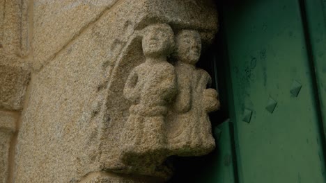 detailed stonework at the entrance of san paio de albán church in coles, ourense, spain
