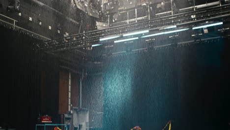 a special effects rain machine in a film cinema studio with a ceiling full of film lights