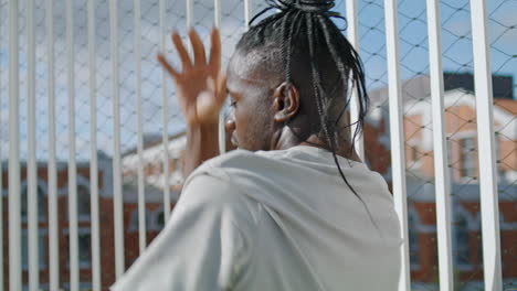 Dreadlocks-guy-moving-body-at-street-closeup.-African-american-man-dancing-hands