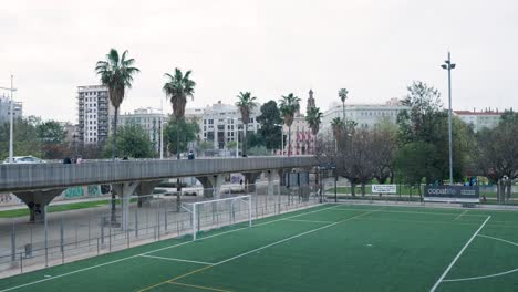 city park with pedestrian bridge and soccer field