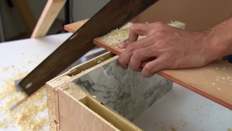 carpenter working on wood craft at workshop