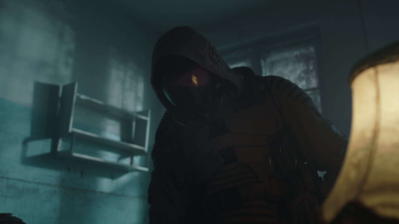 Person in protective gear in a dark room