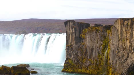 slow establishing shot of the beautiful godafoss waterfall flowing in iceland