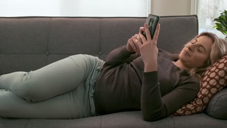 Gorgeous young woman talking on a video call on her phone