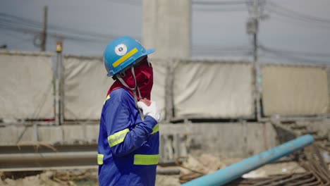 a construction worker wearing protective gear at a job site