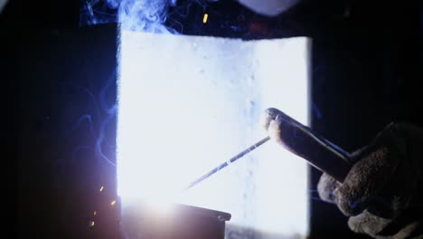 Welder-welding-a-metal