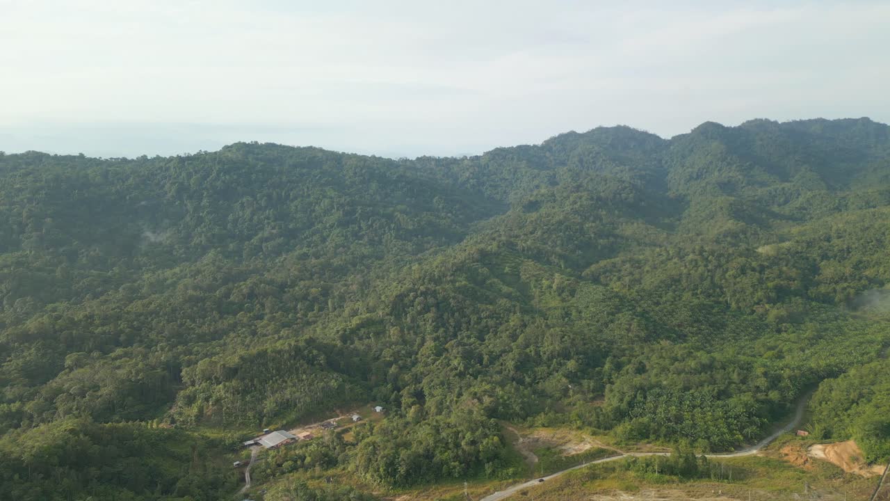 Beautiful Drone View Of Bau To Lundu Pan Borneo Highway During Morning Sunset With Mountain And Valley, Green Forest,Sarawak, Borneo.
