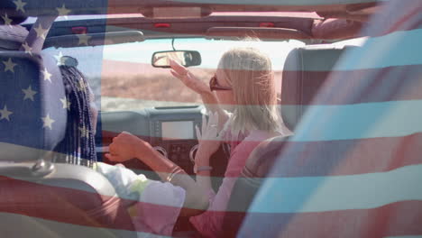 Animation-of-flag-of-usa-over-diverse-women-in-car-by-beach