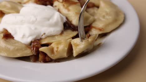 pierogi with sour cream