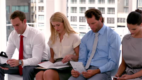 Row-of-nervous-applicants-waiting-for-interview