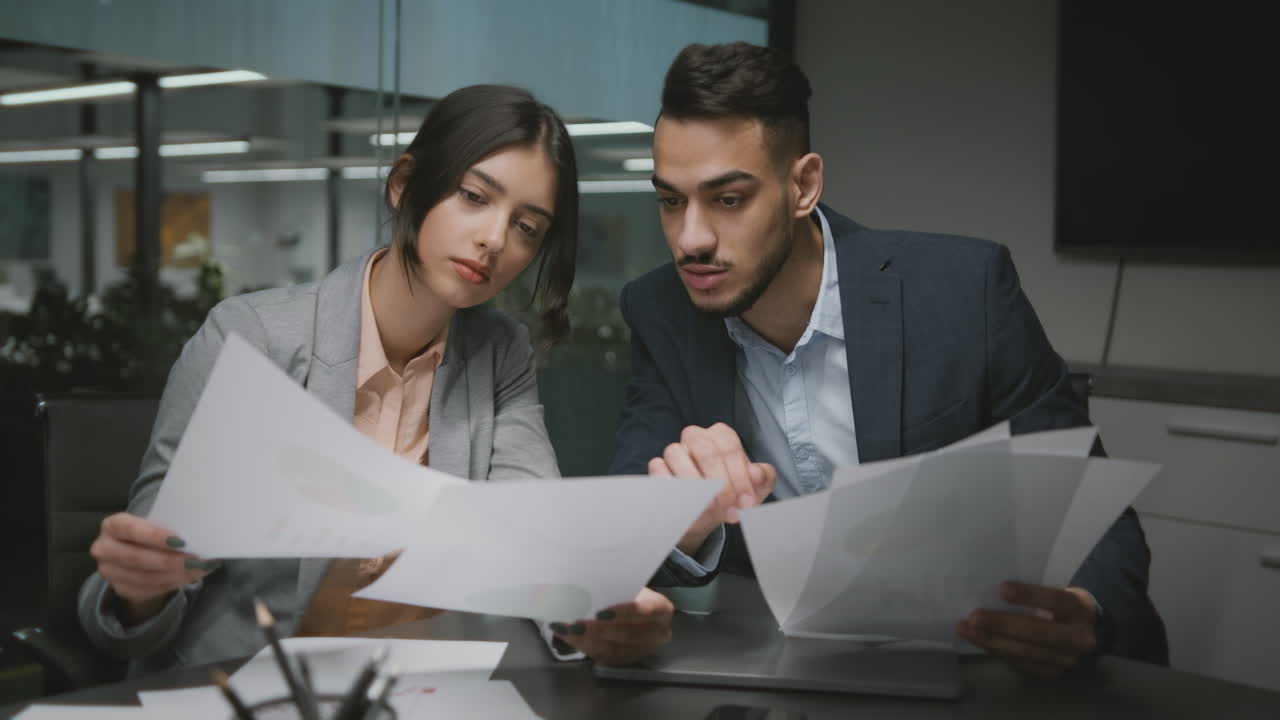 Business Colleagues Discussing Documents in an Office Meeting