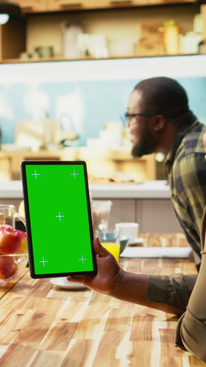 Vertical Video Vertical green screen with family serving breakfast surrounded by good food