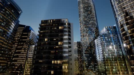 city skyscrapers at night with dark sky