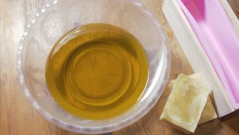 Melted-oils-for-making-cold-process-soap-laid-out-on-table