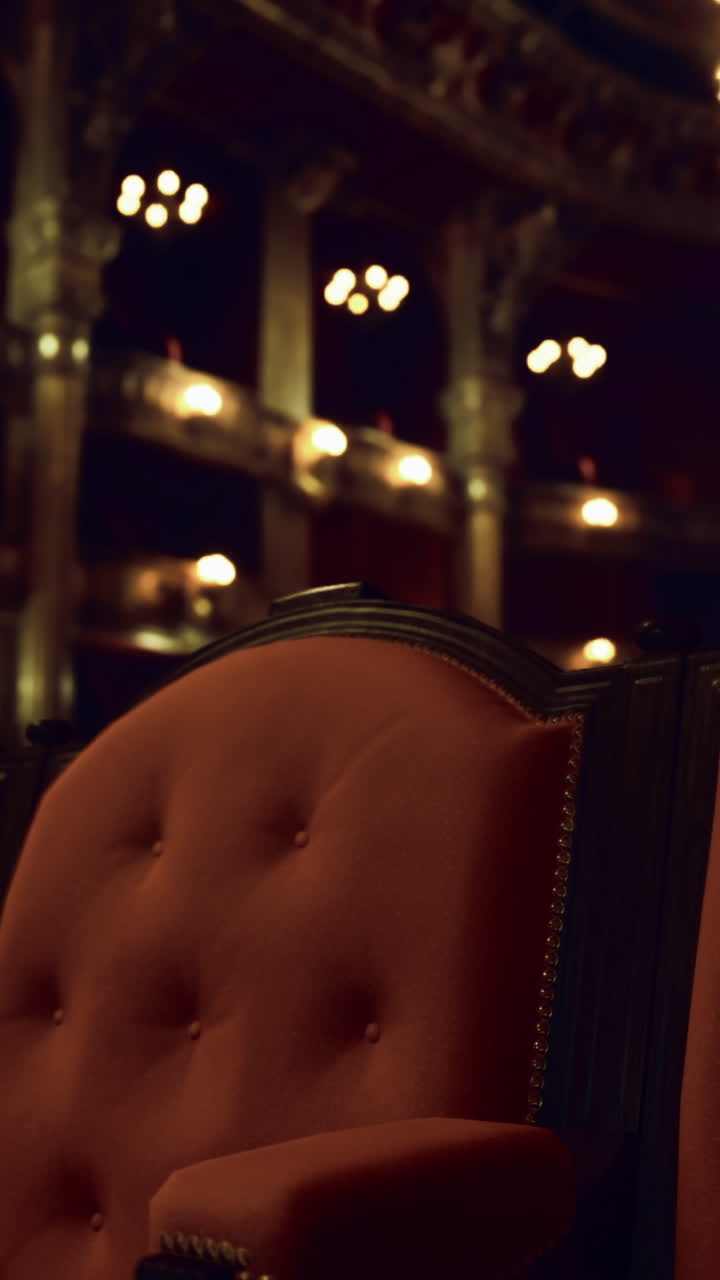 Elegant theater seating exudes vintage charm and opulence