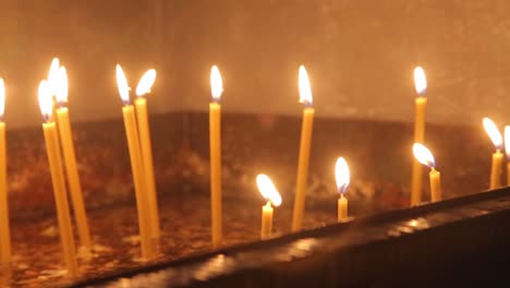 burning candles in a church