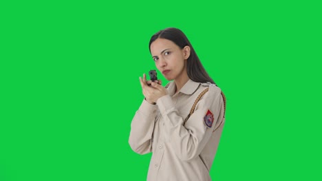 Indian-female-police-officer-posing-with-handgun-Green-screen